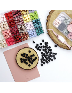 Carbón sealing wax pearls