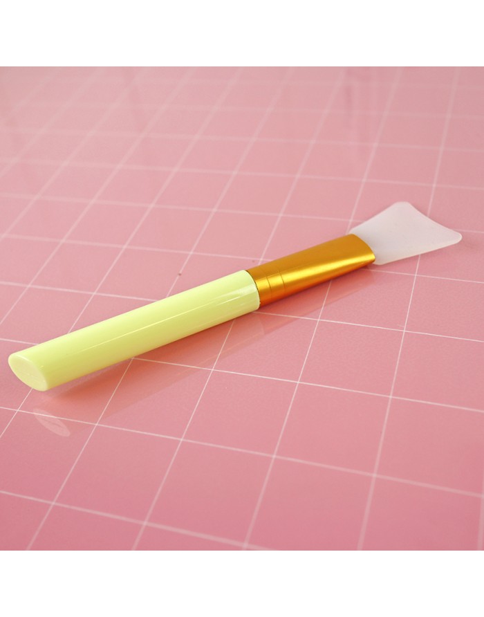 Yellow silicone spatula for adhesives and mix media